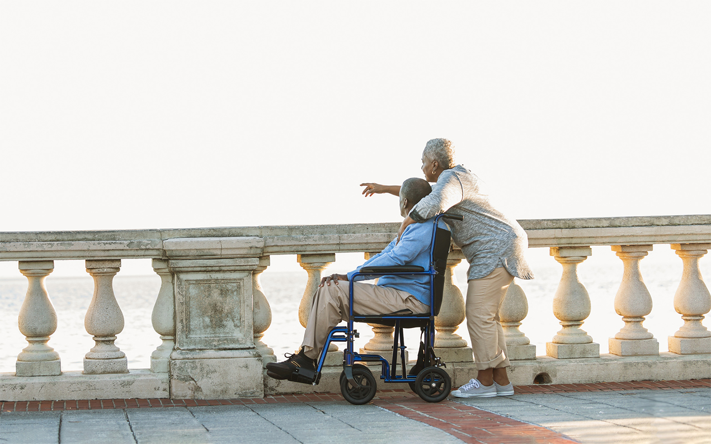 A caregiver and a man in a wheelchair