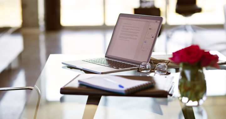 An open laptop sits on a desk